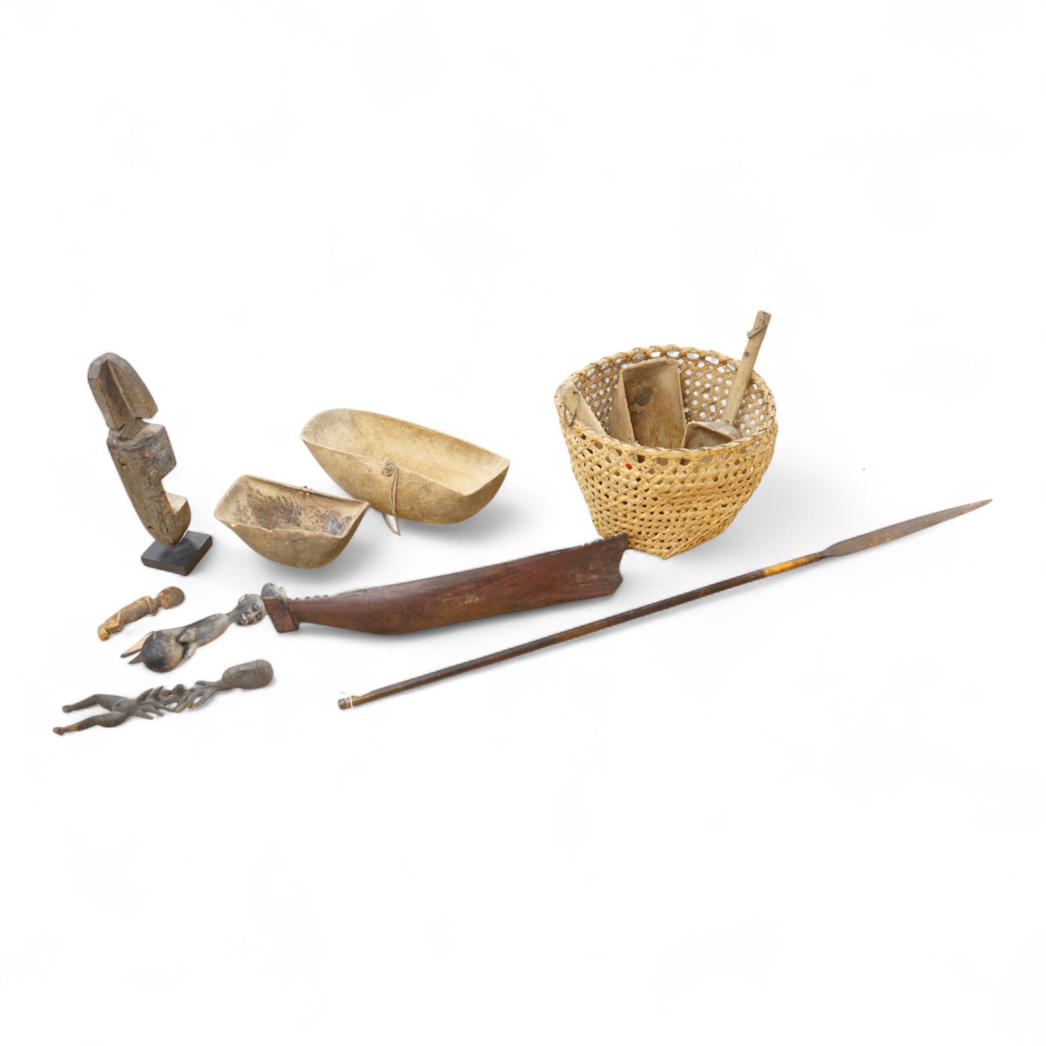 Tribal interest; A collection of various African carvings, a basket and spear